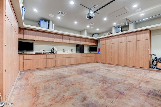 garage with visible vents and recessed lighting