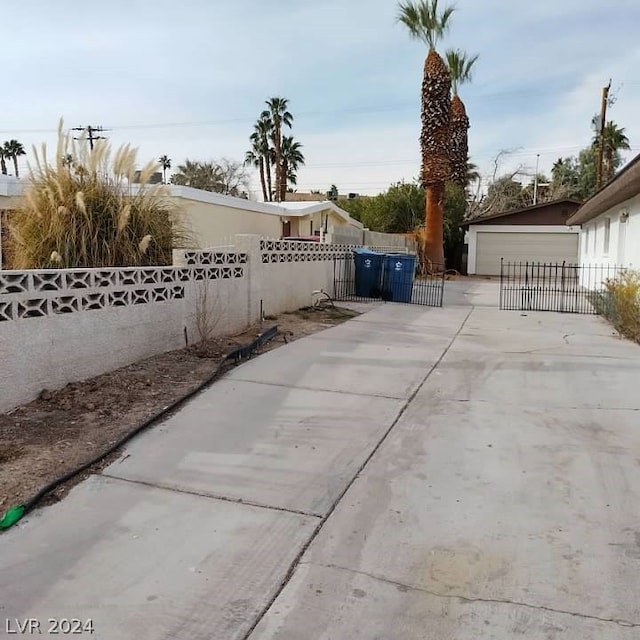 view of patio featuring an outdoor structure and a garage