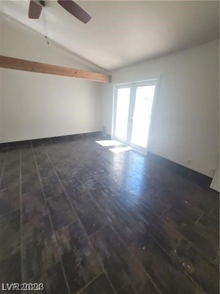 unfurnished room featuring ceiling fan, lofted ceiling, dark wood-type flooring, and french doors