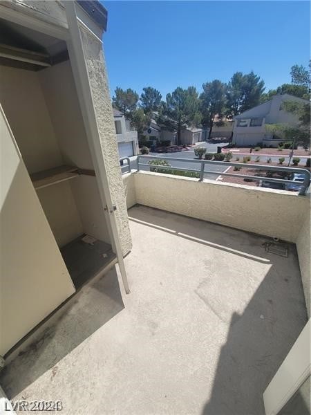 view of patio featuring a balcony