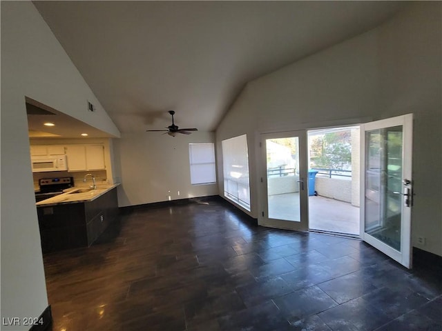 interior space featuring ceiling fan, sink, and high vaulted ceiling