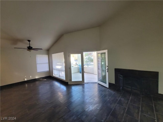 unfurnished living room with french doors, dark hardwood / wood-style flooring, ceiling fan, and lofted ceiling