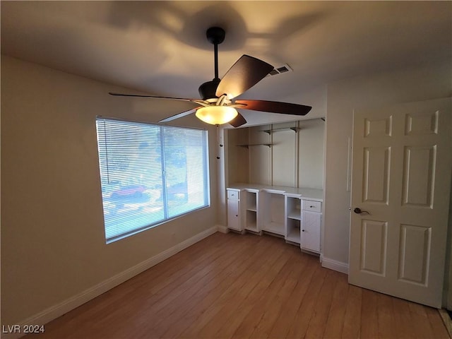 unfurnished bedroom featuring light hardwood / wood-style floors and ceiling fan