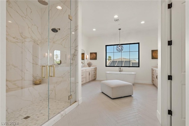 bathroom with separate shower and tub, vanity, and parquet floors