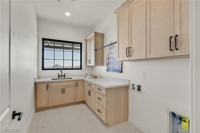 kitchen featuring sink and light brown cabinets