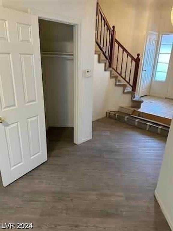 entrance foyer with dark hardwood / wood-style floors