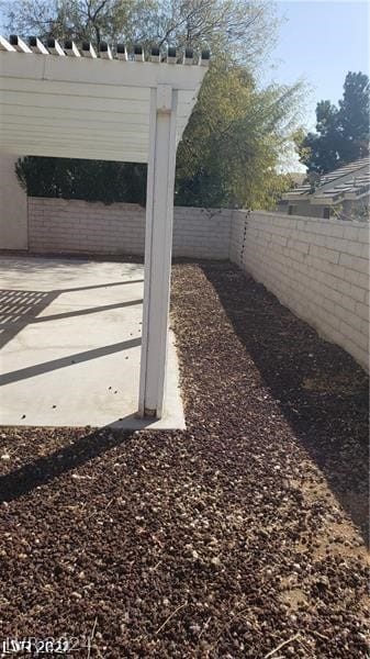 exterior space with a patio and a pergola