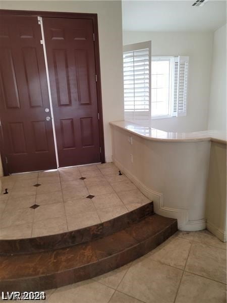 entrance foyer with tile floors