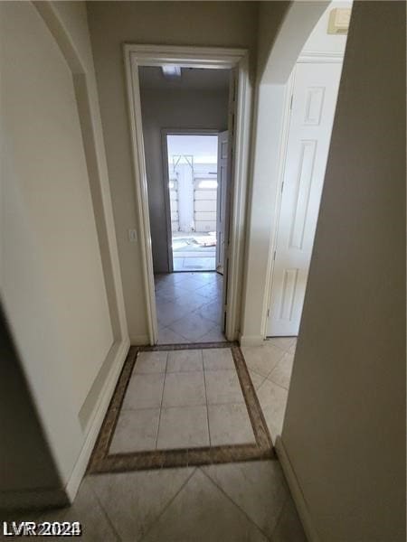 corridor with light tile floors