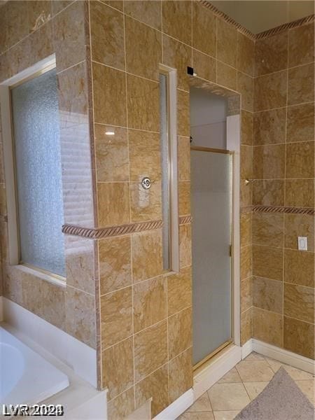 bathroom with tile walls, tile floors, and plus walk in shower