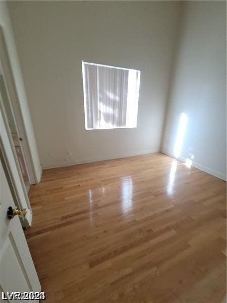 unfurnished room featuring hardwood / wood-style floors