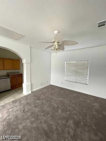 carpeted empty room with ceiling fan