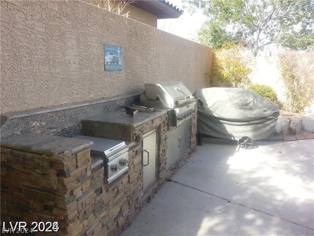 view of patio / terrace featuring area for grilling and grilling area