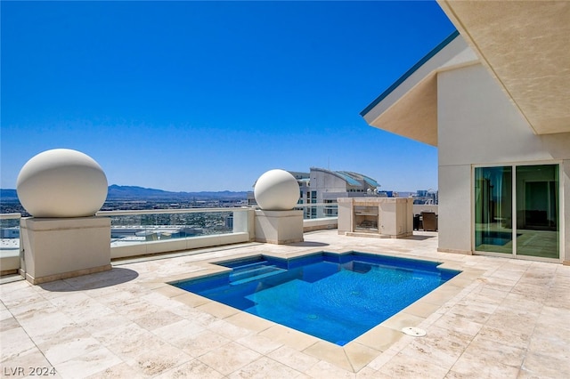 view of pool with a mountain view