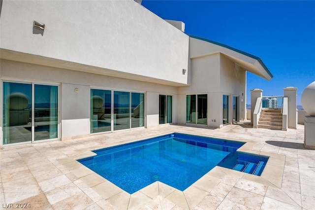 view of swimming pool with a patio