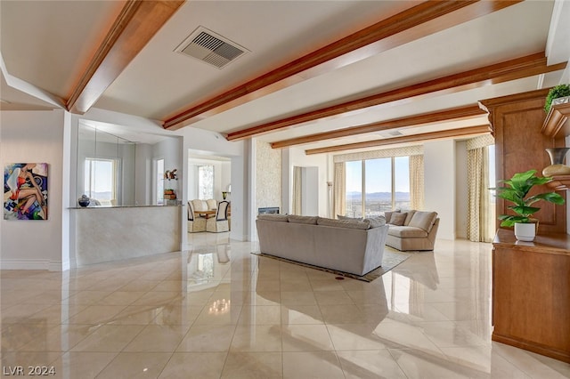 tiled living room featuring beam ceiling