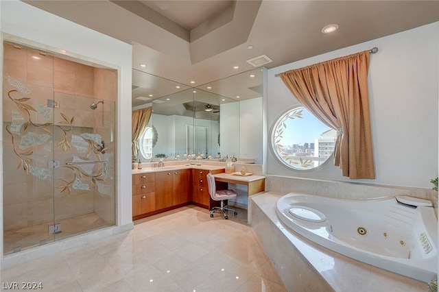 bathroom with vanity, separate shower and tub, tile floors, and a tray ceiling