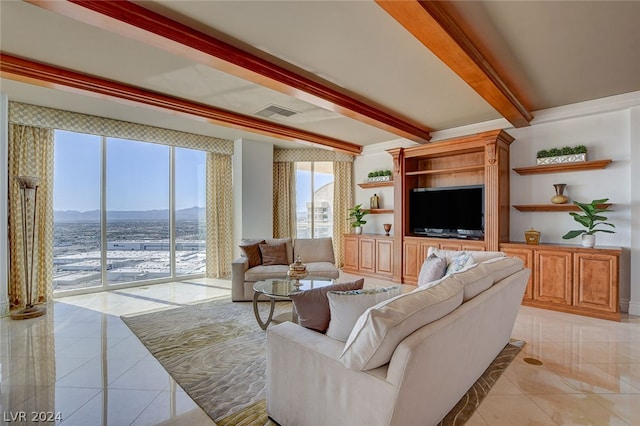 living room featuring beamed ceiling, a mountain view, and light tile floors