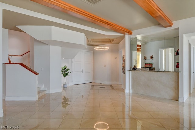 tiled spare room with beam ceiling