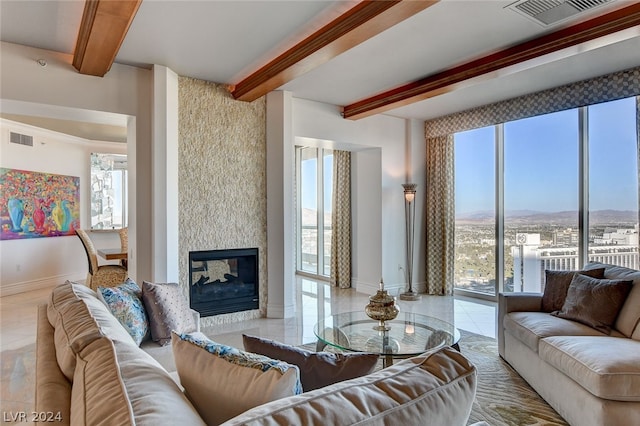 tiled living room featuring plenty of natural light, beamed ceiling, and a multi sided fireplace