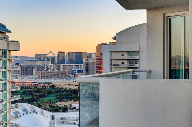 view of balcony at dusk