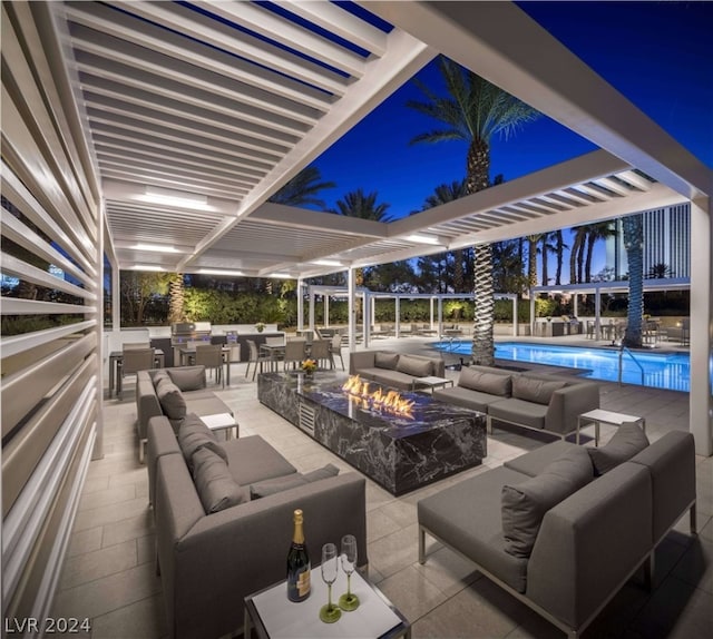 exterior space featuring a patio, a pergola, and an outdoor living space with a fire pit