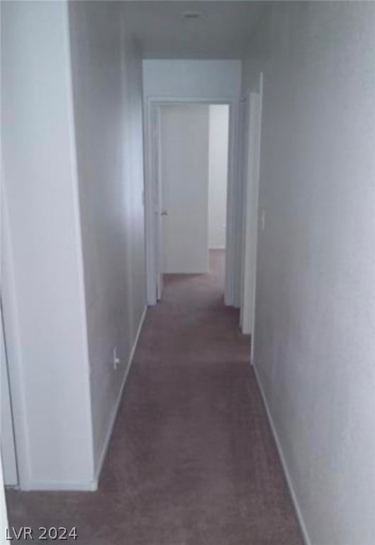 hall with dark carpet