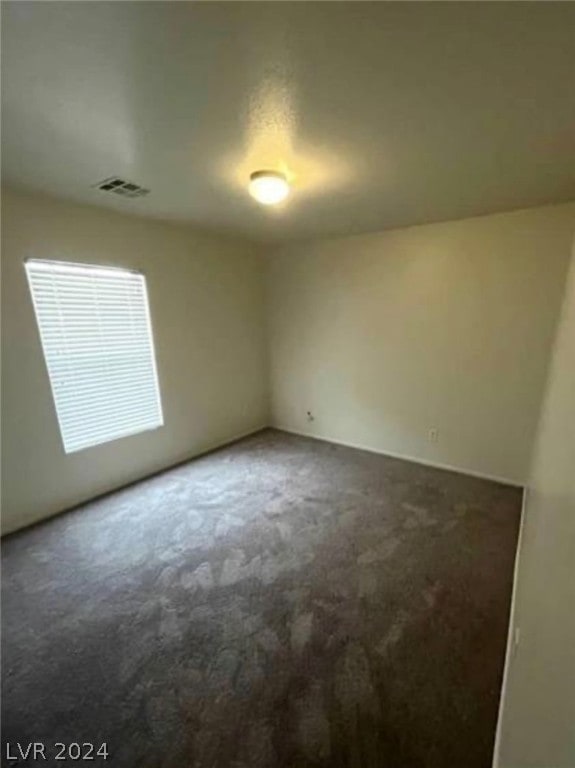 spare room featuring carpet