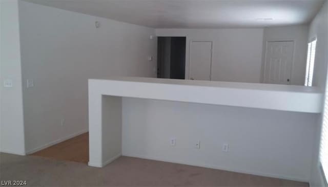 unfurnished room featuring carpet flooring