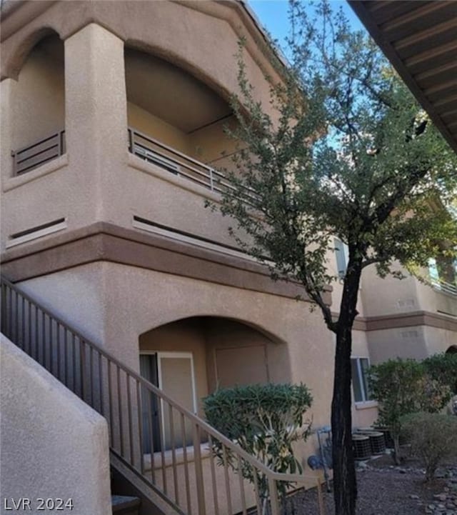 view of side of property featuring a balcony