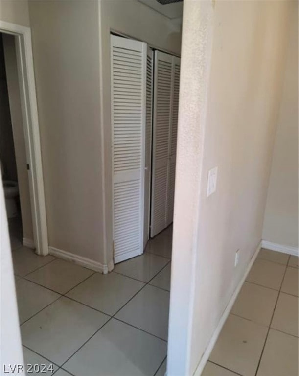 hallway with light tile floors