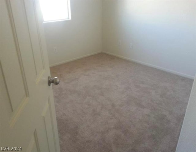 spare room with carpet floors