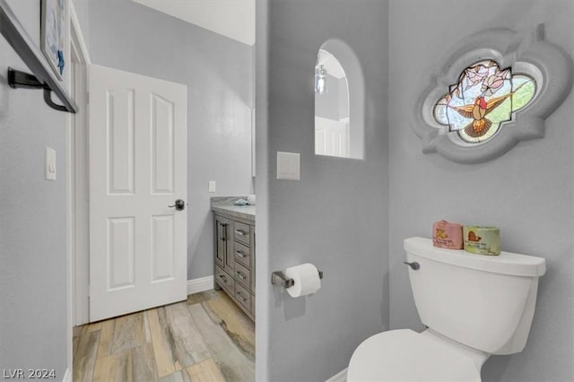 bathroom with toilet and vanity