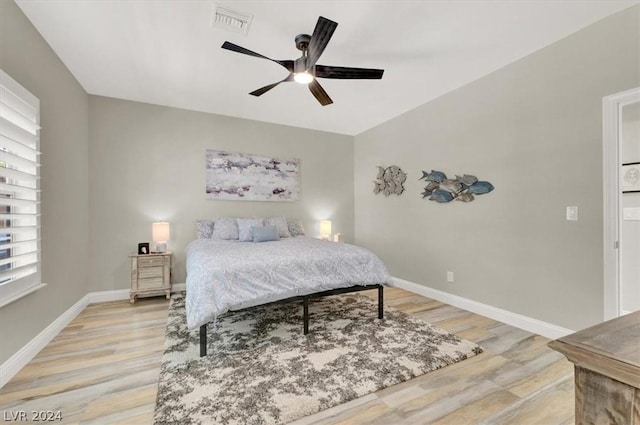 bedroom featuring ceiling fan and light hardwood / wood-style floors