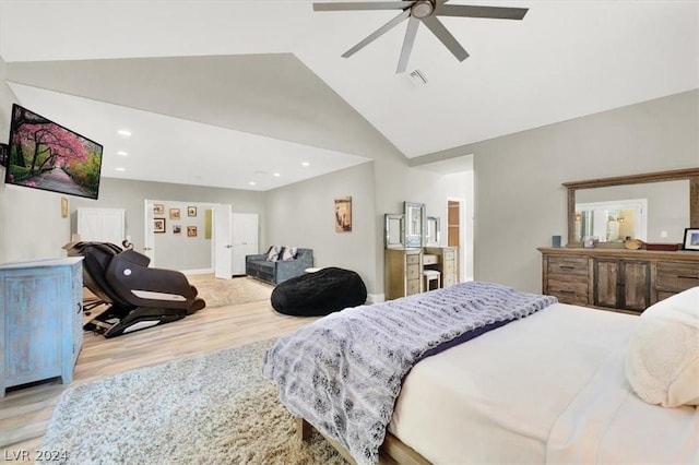 bedroom featuring light wood-type flooring, ceiling fan, and lofted ceiling