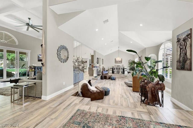 living room with ceiling fan and light hardwood / wood-style floors