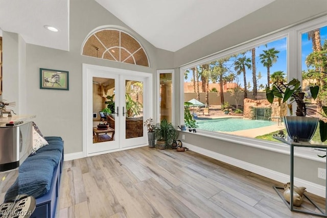 sunroom with vaulted ceiling and french doors