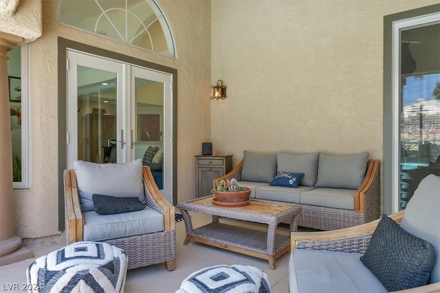 balcony with french doors and outdoor lounge area