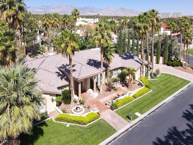 birds eye view of property featuring a mountain view