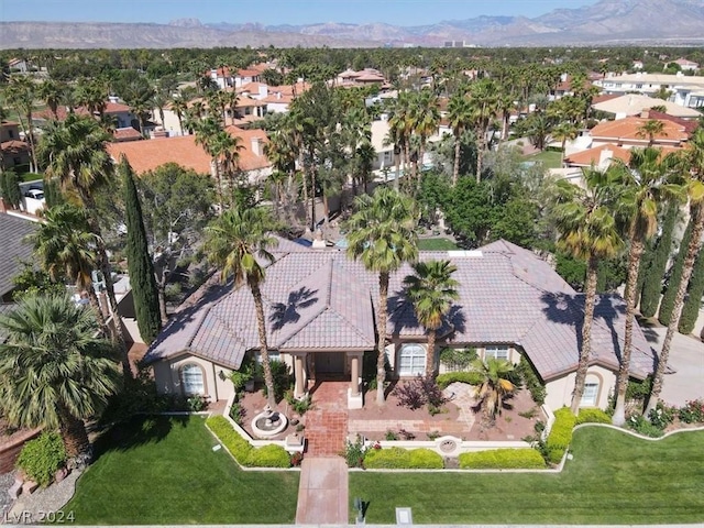 birds eye view of property with a mountain view