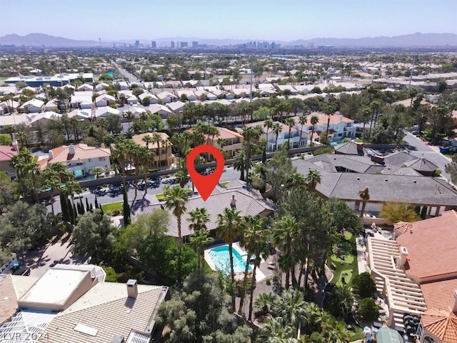 birds eye view of property featuring a mountain view