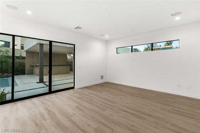 spare room featuring hardwood / wood-style flooring