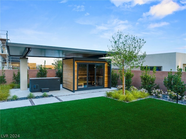 rear view of property featuring a yard