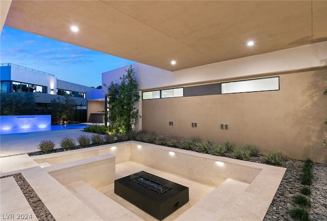 patio terrace at dusk with a fire pit