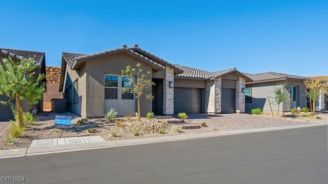 view of front of property with a garage