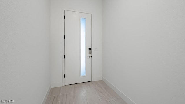 doorway featuring light tile patterned floors