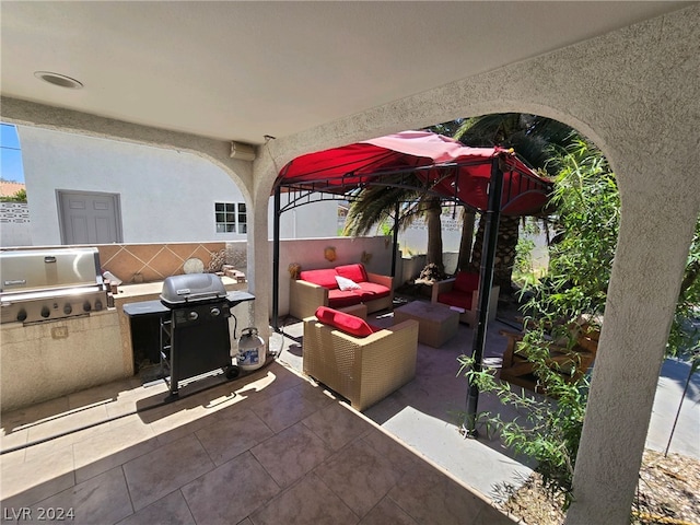 view of patio featuring area for grilling, a grill, and outdoor lounge area