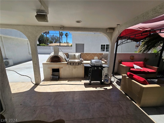 view of patio / terrace featuring grilling area and exterior kitchen