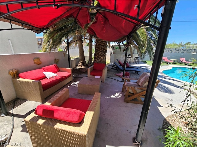 view of patio / terrace with a fenced in pool and an outdoor living space