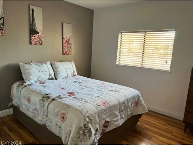 bedroom featuring dark wood-type flooring